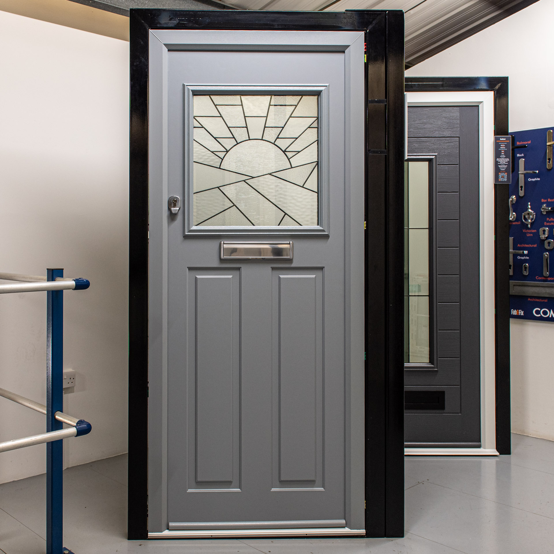 Anthracite Comp Door composite door with an arched top light and traditional panelling